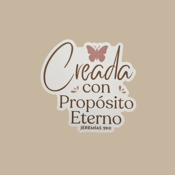 Decorative sticker with text 'Creada con Propósito Eterno' and a butterfly on a beige background