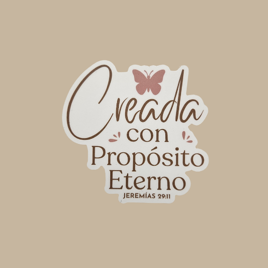 Decorative sticker with text 'Creada con Propósito Eterno' and a butterfly on a beige background
